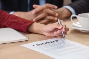 Closeup Young Asian Woman Graduate Hand Signing The Contract